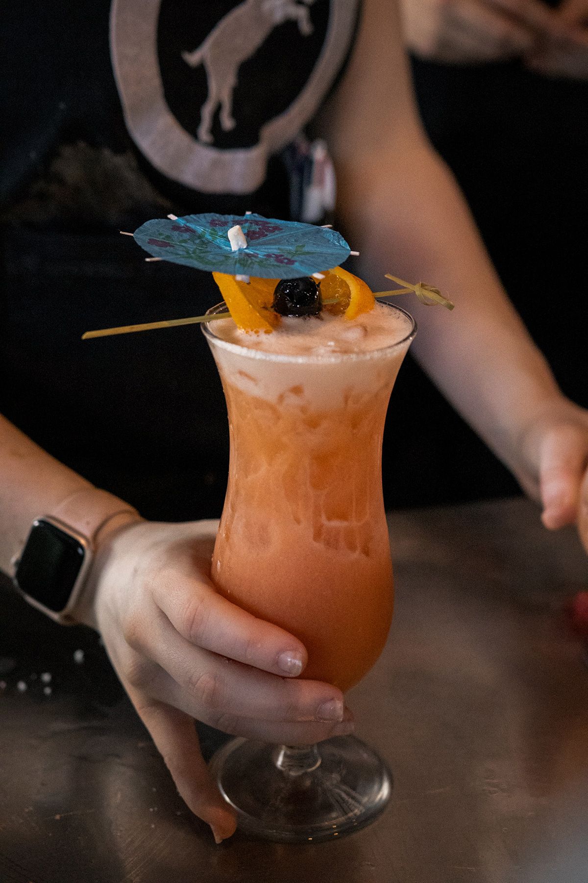 Bartender serving a cocktail at Goat House